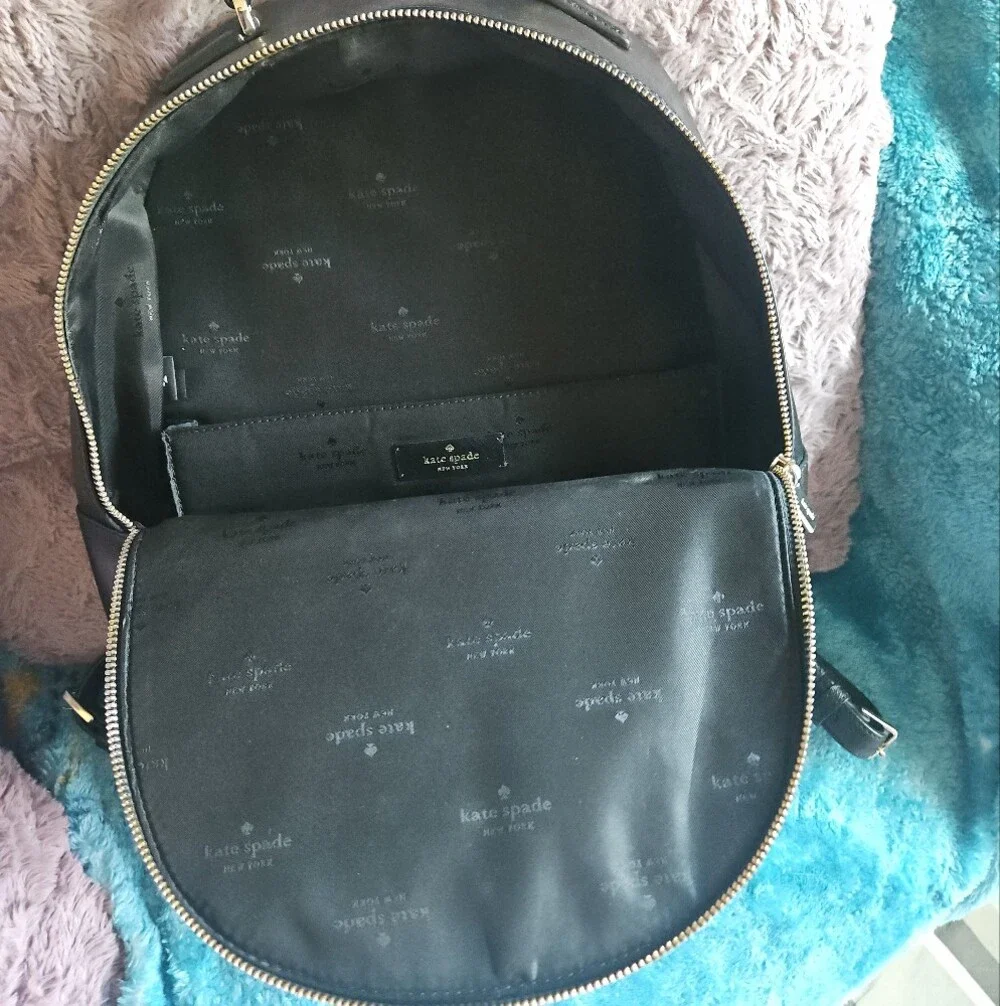 AS-IS Kate Spade black leather backpack LEFT STRAP AT THE TOP TORN. STILL NEW